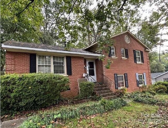 tri-level home with brick siding