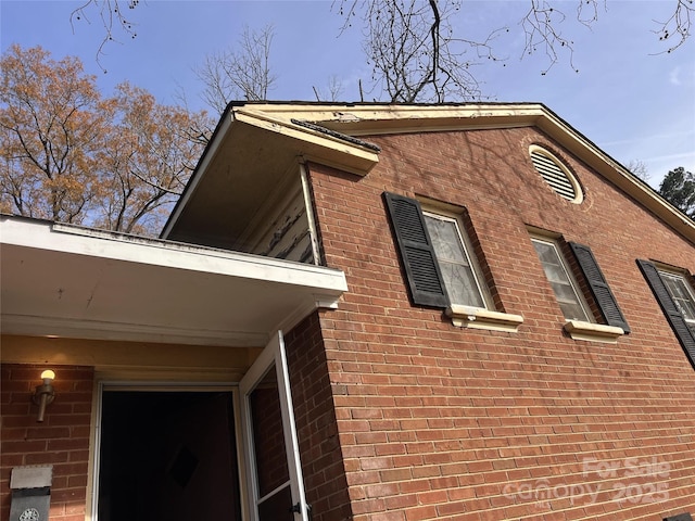 view of home's exterior featuring brick siding