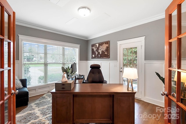 office area featuring dark wood finished floors, crown molding, french doors, and wainscoting