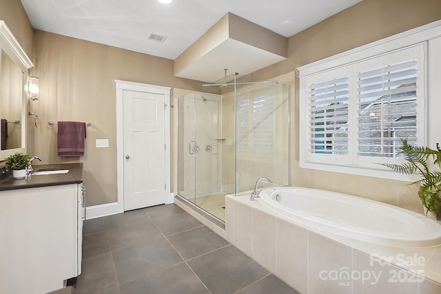 bathroom featuring vanity, visible vents, tile patterned flooring, a shower stall, and a bath