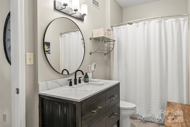 full bathroom with tile patterned floors, visible vents, toilet, and vanity