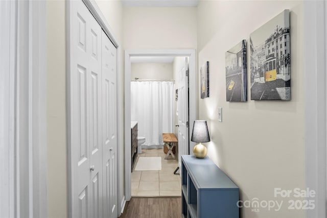 corridor with dark tile patterned floors