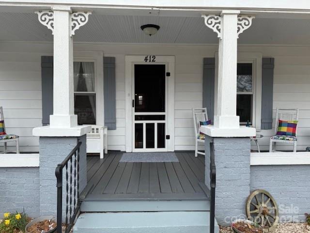 doorway to property featuring a porch