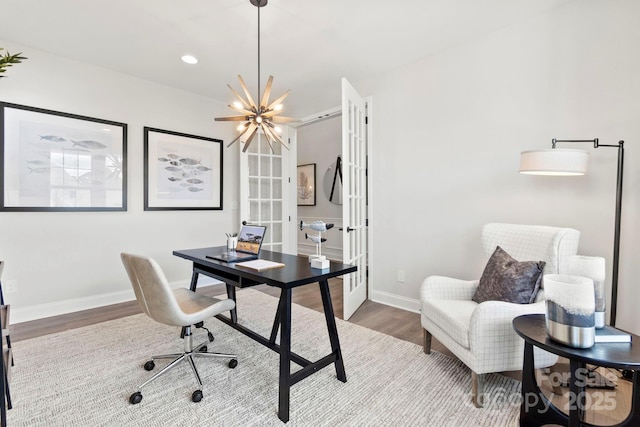 office area featuring wood finished floors, baseboards, recessed lighting, french doors, and a notable chandelier