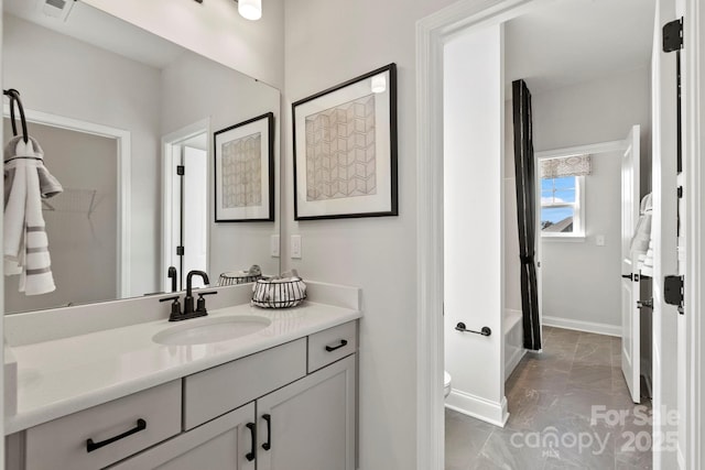 full bathroom featuring visible vents, toilet, vanity, baseboards, and shower / bathtub combination