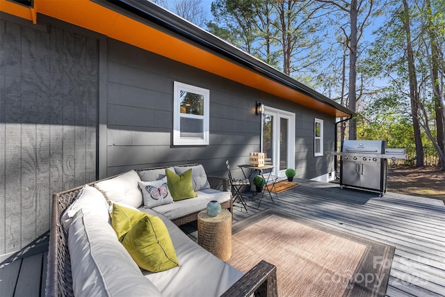 deck featuring area for grilling and an outdoor living space