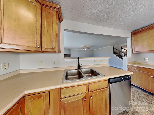 kitchen with dishwasher, light countertops, brown cabinets, a peninsula, and a sink