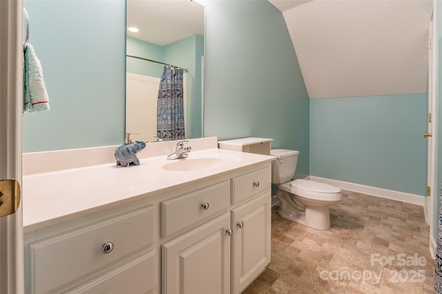 bathroom with toilet, lofted ceiling, curtained shower, baseboards, and vanity