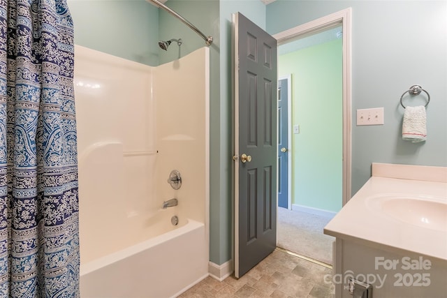 full bath featuring vanity, baseboards, and shower / bathtub combination with curtain