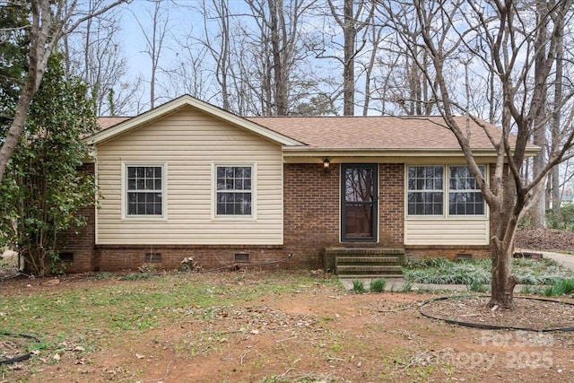 view of front of home with crawl space, entry steps, and roof with shingles