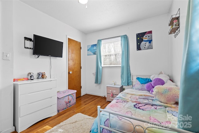 bedroom with light wood-type flooring