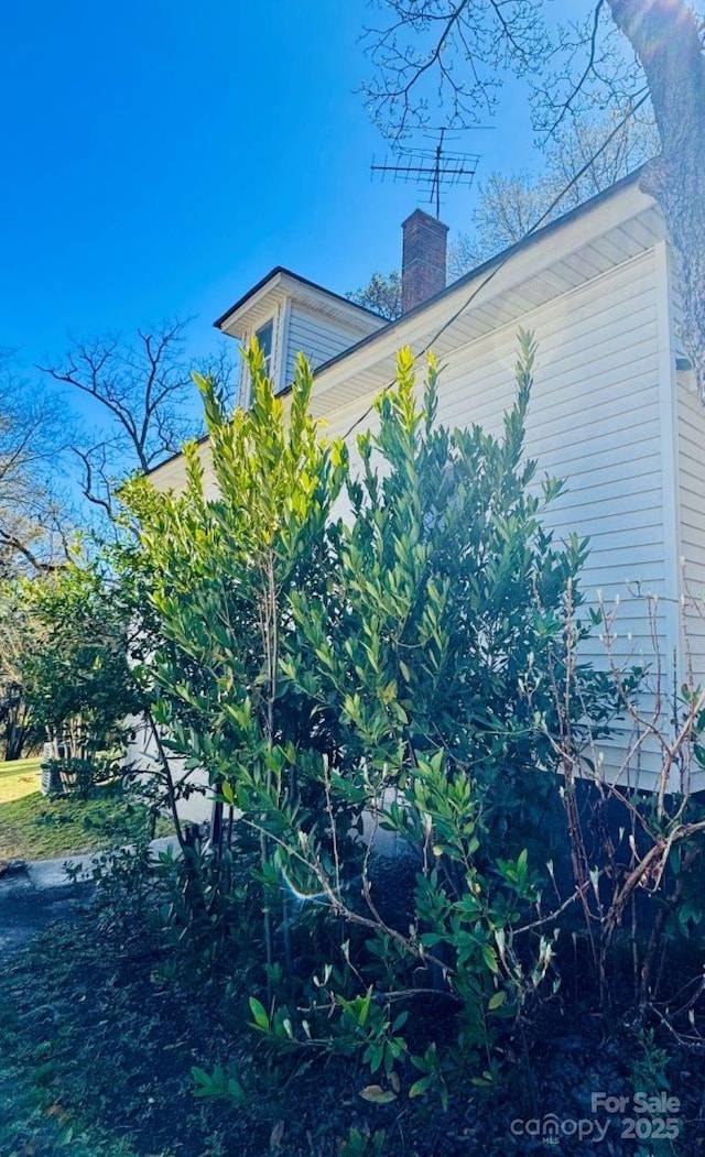 149 Crescent Dr, Chesterfield, SC 29709 - view of side of home featuring a chimney