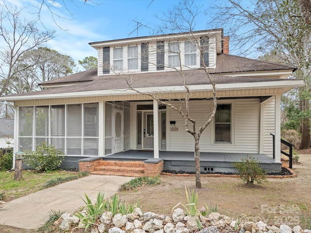 149 Crescent Dr, Chesterfield, SC 29709 - view of front of property featuring a shingled roof, a sunroom, a chimney, and a porch