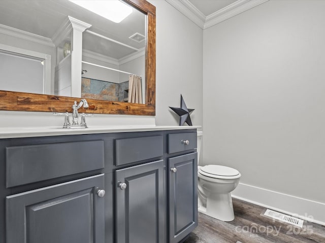 149 Crescent Dr, Chesterfield, SC 29709 - full bathroom featuring vanity, crown molding, toilet, visible vents, and wood finished floors