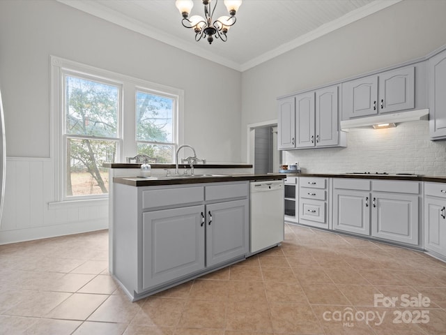149 Crescent Dr, Chesterfield, SC 29709 - kitchen with dark countertops, stovetop, under cabinet range hood, and dishwasher