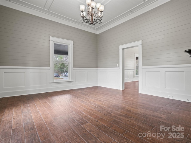 149 Crescent Dr, Chesterfield, SC 29709 - unfurnished room with dark wood-style flooring and an inviting chandelier