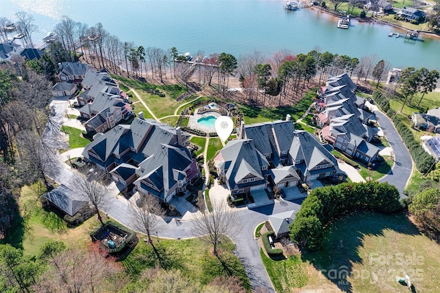 birds eye view of property with a residential view and a water view