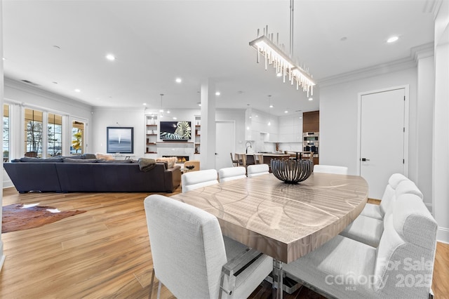 dining room with visible vents, recessed lighting, light wood-type flooring, and crown molding