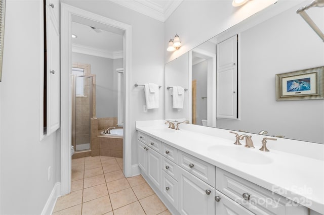 full bath featuring a sink, ornamental molding, a shower stall, and tile patterned flooring