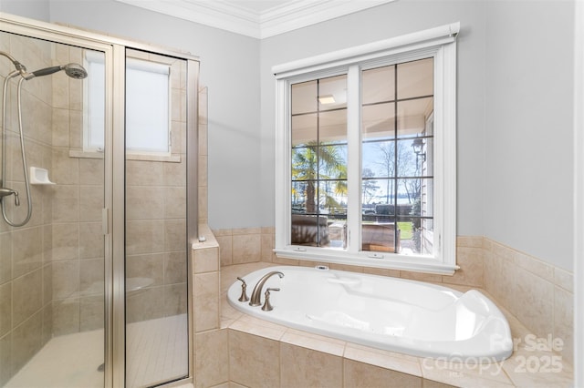 bathroom with a bath, a stall shower, and ornamental molding