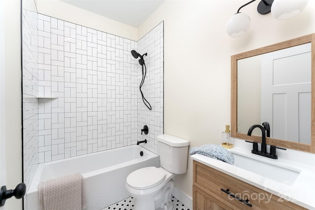 bathroom featuring vanity, toilet, and shower / bathing tub combination