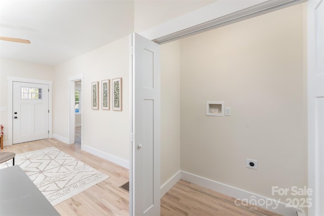 foyer entrance with light wood-type flooring, baseboards, and a ceiling fan