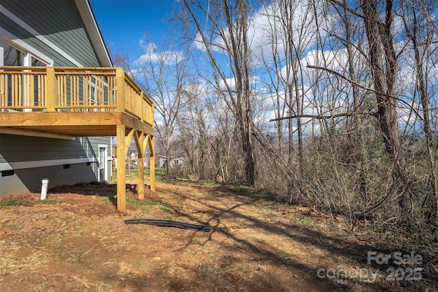 view of yard with a wooden deck