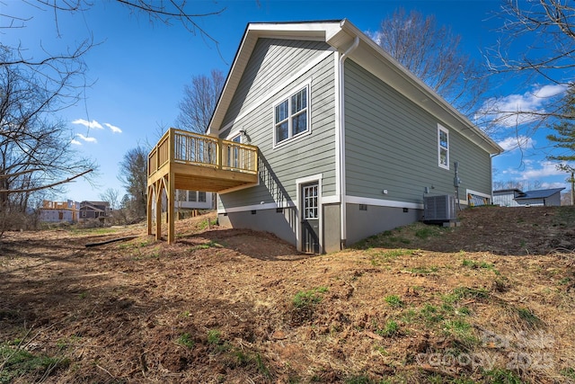 view of home's exterior featuring central air condition unit and a deck