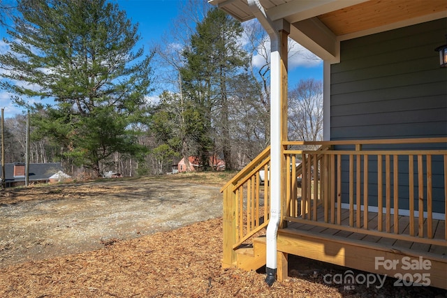 view of yard featuring a wooden deck