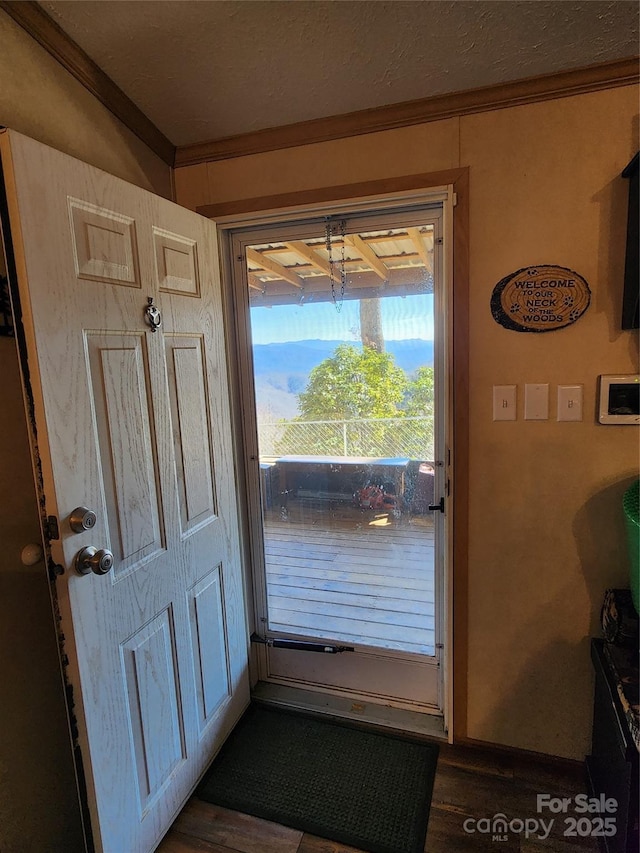 doorway featuring crown molding