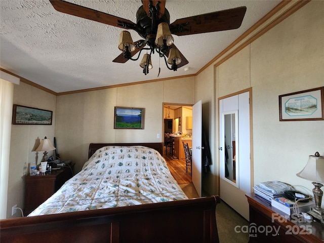 bedroom with ceiling fan, crown molding, lofted ceiling, and a textured ceiling