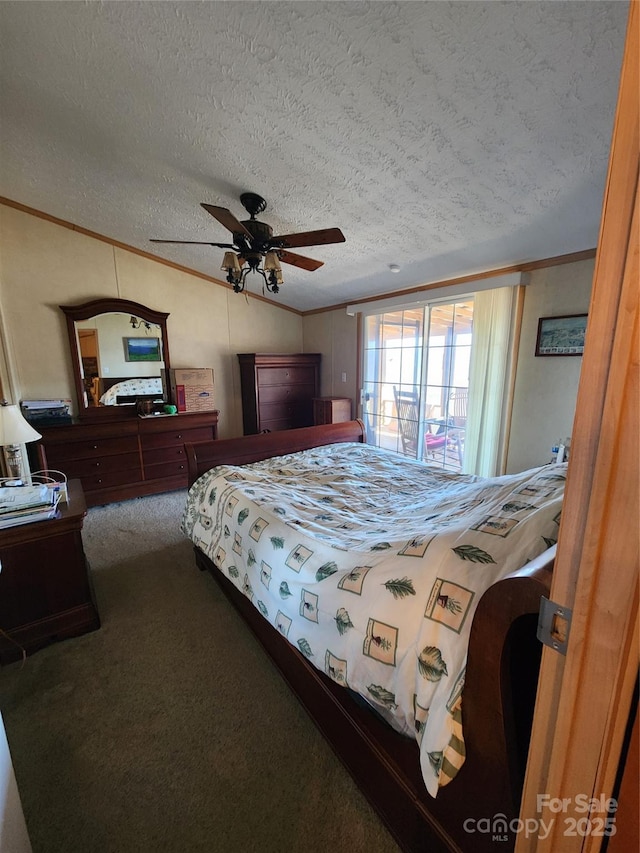 carpeted bedroom with a textured ceiling, vaulted ceiling, ceiling fan, and ornamental molding