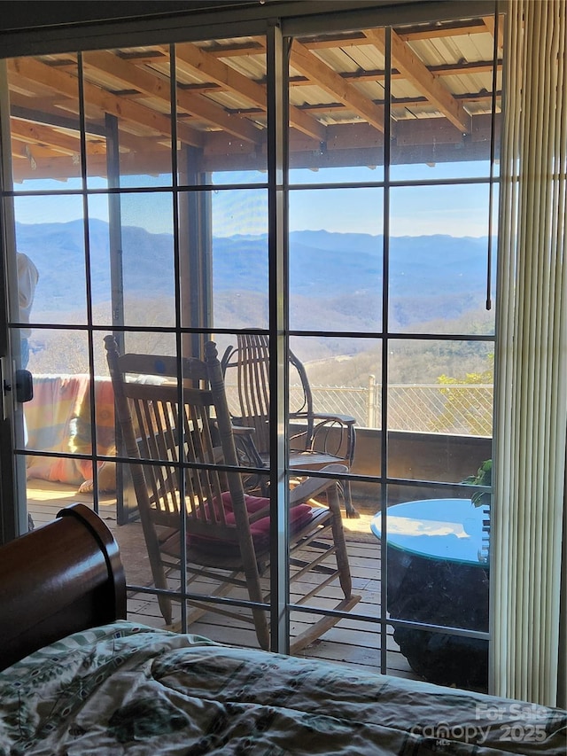 bedroom featuring a mountain view