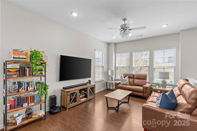 living room featuring recessed lighting, baseboards, ceiling fan, and wood finished floors