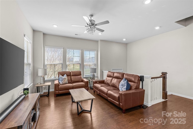 living area with dark wood finished floors, recessed lighting, baseboards, and a ceiling fan