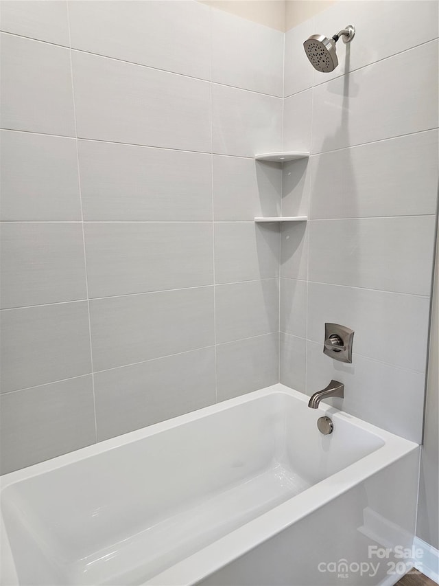 bathroom featuring washtub / shower combination