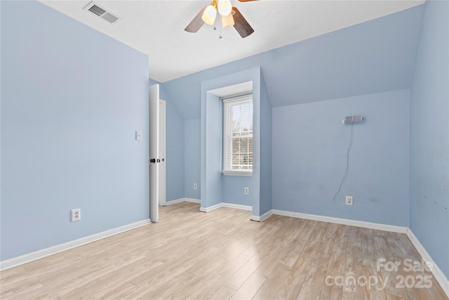 additional living space featuring visible vents, baseboards, wood finished floors, and a ceiling fan