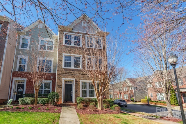 view of front of house with brick siding