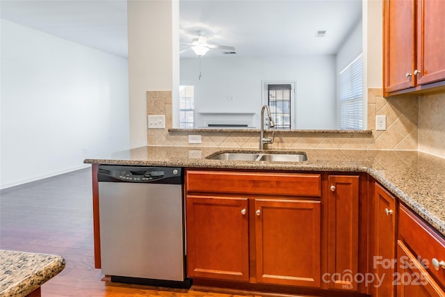 kitchen with a wealth of natural light, dishwasher, ceiling fan, and a sink