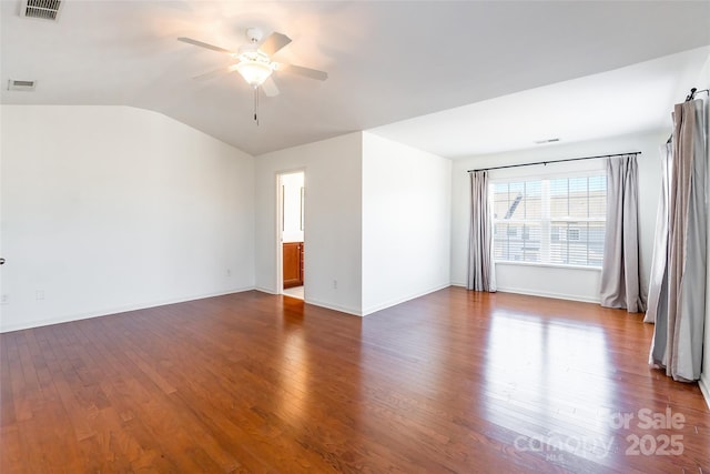 unfurnished room featuring visible vents, lofted ceiling, ceiling fan, and dark wood-style flooring