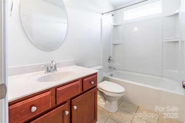 full bathroom featuring tile patterned flooring, bathing tub / shower combination, toilet, and vanity