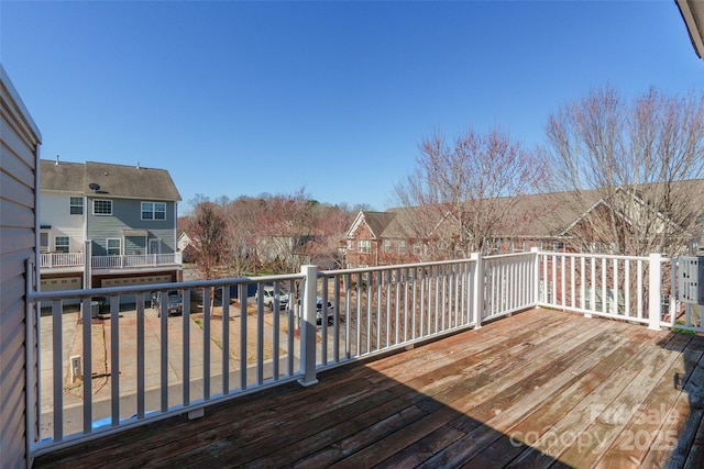 wooden terrace with a residential view