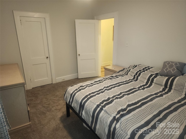 bedroom featuring baseboards and carpet floors