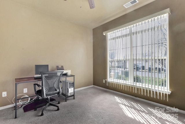 office with visible vents, carpet floors, baseboards, and ceiling fan