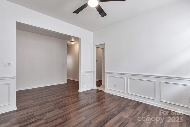 empty room with wood finished floors and a ceiling fan