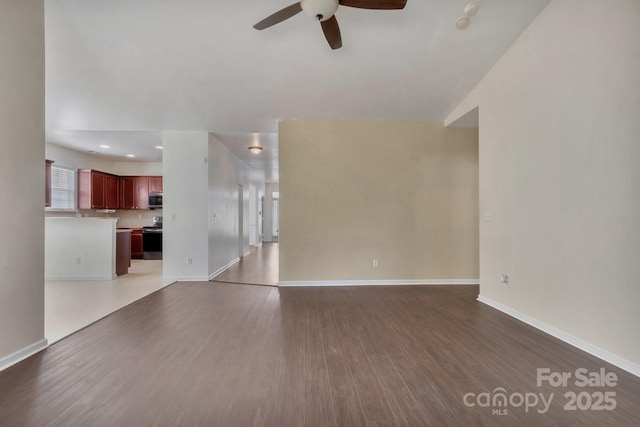 unfurnished living room with dark wood-style floors, recessed lighting, baseboards, and ceiling fan