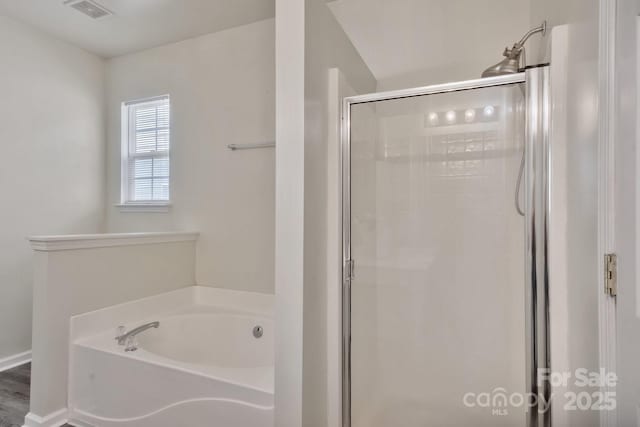 full bathroom with a bath, visible vents, and a shower stall