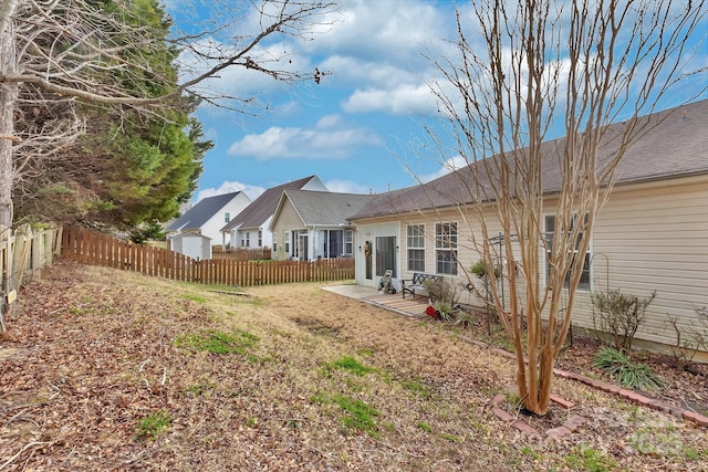 back of house featuring fence