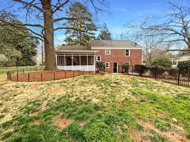 back of property with fence, a vegetable garden, a sunroom, a chimney, and brick siding