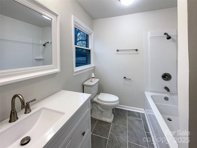 bathroom with shower / bath combination, toilet, vanity, and baseboards